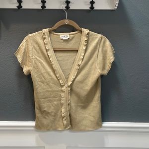 Tan shrug, size medium, 100% acrylic. Gently loved, non-smoking home.